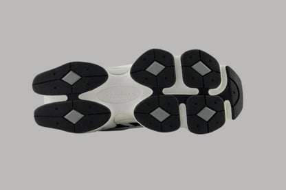 Bróga spóirt unisex New Balance 9060 Dubh Bán